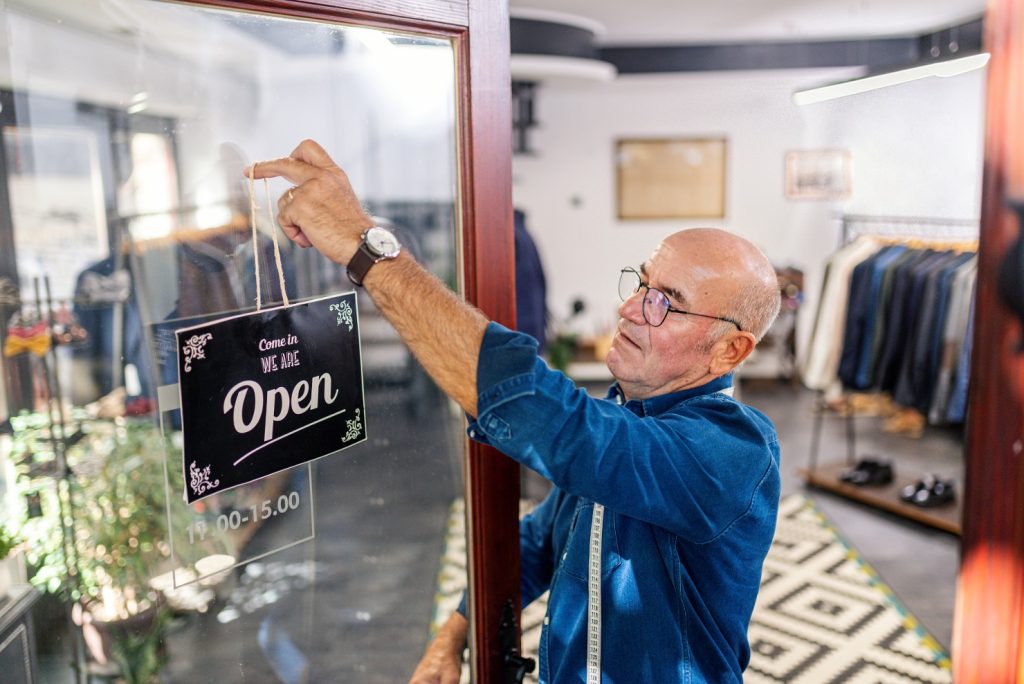 Shop keeper opening door
